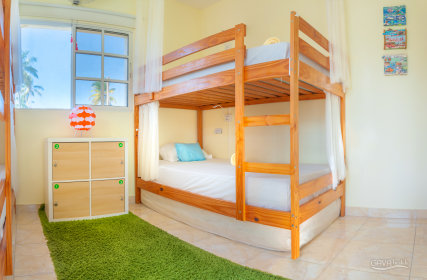  Mixed four-bed room with shared bathroom.